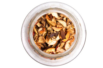 Dried fruits in a glass jar. Dried apples are stored in a glass jar top view.