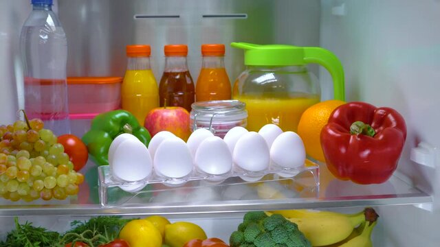 Open refrigerator filled with food