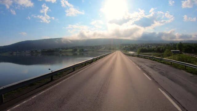 vehicle point of view driving a car on a road in norway 