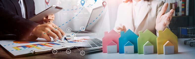 business women real estate agent holding house and house key selling or renting property for money. Concept for real estate, moving home or renting property