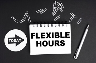 On a black background, a round plate - Today and a notebook with the inscription - FLEXIBLE HOURS