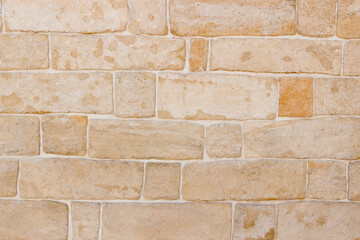 Stone wall texture background - grey stone siding with different sized stones. Texture of a stone wall. Old castle stone wall texture background. 