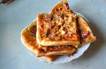 cooking pizza at home in the kitchen, close-up