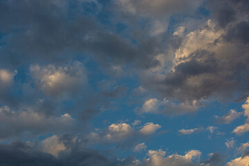 Naklejka na ściany i meble blue sky, dark clouds and sun lights. desktop background.