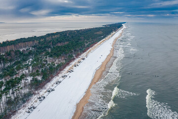 Snowy beach on Hel peninsula. Winter Baltic Sea. Aerial view