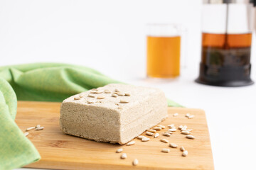 sunflower halva on a white table with seeds