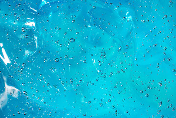 Gel with hyaluronic acid. Blue background with oxygen bubbles. Cosmetic cream with oxygen bubbles