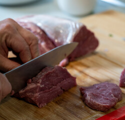 raw meat on a cutting board
