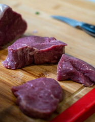 raw meat on a cutting board