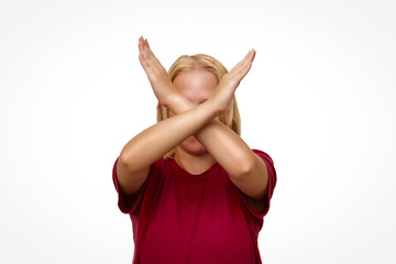 Girl with arms crossed in front of face isolated on white background