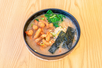 Ramen with nori seaweed, breaded fried chicken, boiled egg, noodles and spinach
