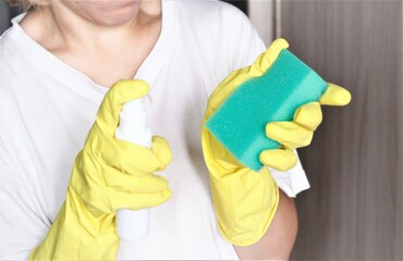 Closeup person with yellow gloves cleaning the kitchen housework health cleaner home housekeeping domestic service worker hygiene wash