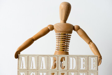isolated manikin carries an alphabetical stencil