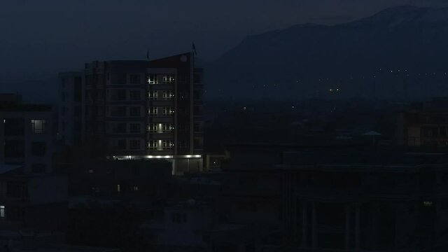 Afghanistan scene - camera pans left  - night time in Kabul city