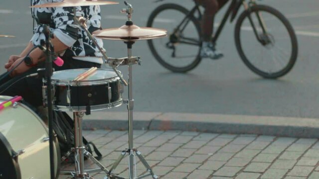 drum set drummer plays cymbals tom bass drum snare hi-hat.concept music street