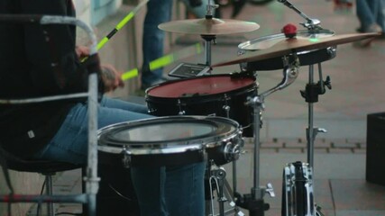 drum set drummer plays cymbals tom bass drum snare hi-hat.concept music street