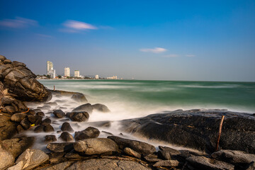 The sea at Hua Hin, view from Khao Takiab rocks long exposure for soft and dynamic waves crashing into the rocks.