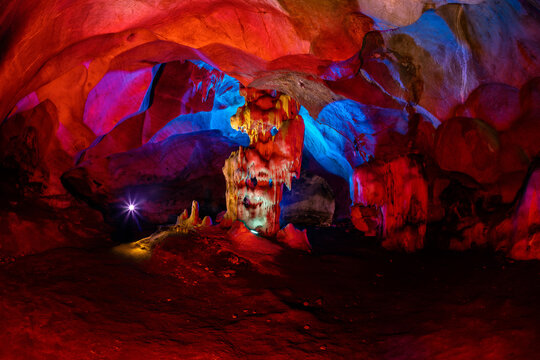 Strange stalactites and stalagmites look like sculptures created by nature inside the cave "Laplae", one of the natural attractions of Hua Hin District.