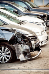 Damaged cars in line at the auto repair shop