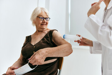 Fototapeta premium emotional nurse and patient syringe injection vaccine passport