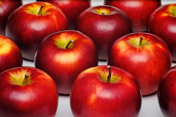 close up shot of a group of many freshness red apples with some yellow color marks