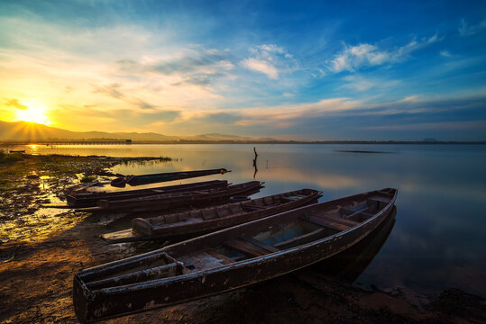 Fishing boats at fisherman village during Sunrise © tonjung