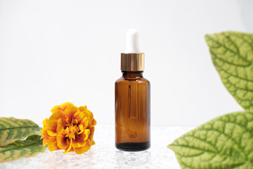 face care oil or serum in amber glass bottle with pipette. autumn decor, fall sale, unbranded product. anti age and cold protection cosmetic for cool season.