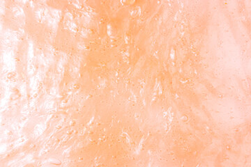 Liquid orange slime background with bubbles and highlights