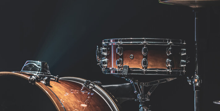 Part of a drum kit, drums on a dark background, copy space. - Powered by Adobe