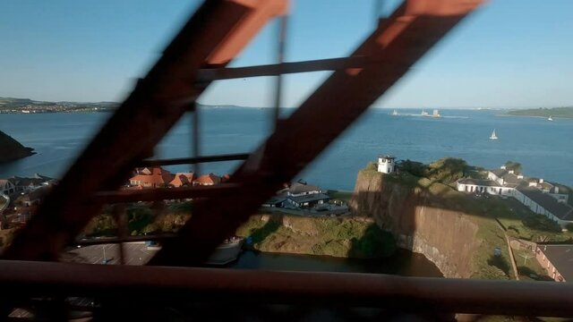 Crossing the Firth of Fourth in Scotland, UK along the famous Forth Railway Bridge, overlooking the Inchgarvie island