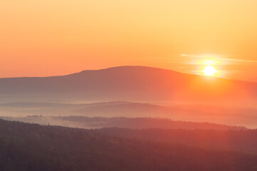 Obraz premium sunrise landscape with fog in the mountains