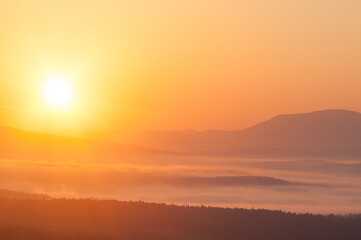 sunrise landscape with fog in the mountains