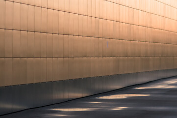 reflected light of the setting sun on a vertical wall with a matte sheen of the sunset