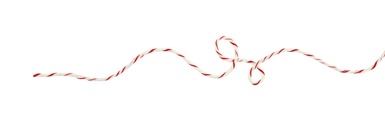 Curled white and red Christmas wrapping rope in a line arrangement isolated on white