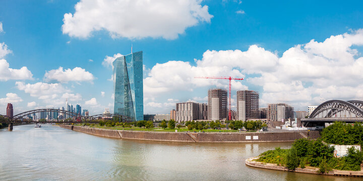 River Main and the european city skyline, financial centre of Frankfurt Main Ostend. Skyscraper buildings, Germany. Skyscraper buildings on construction site in Ostend and Bridge Honsellbr&uuml;cke.