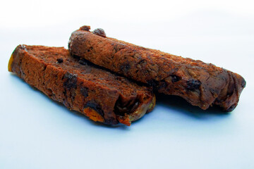 steamed brownie bread on a white background, typical gradations from asia
