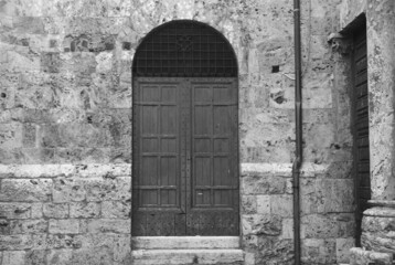 Fototapeta premium Antique medieval door in black and white. 