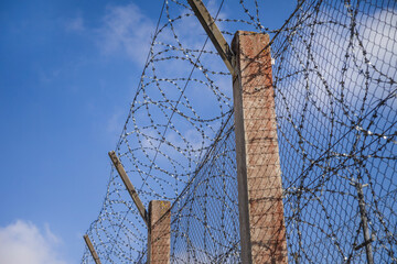 prison fence with barbed wire
