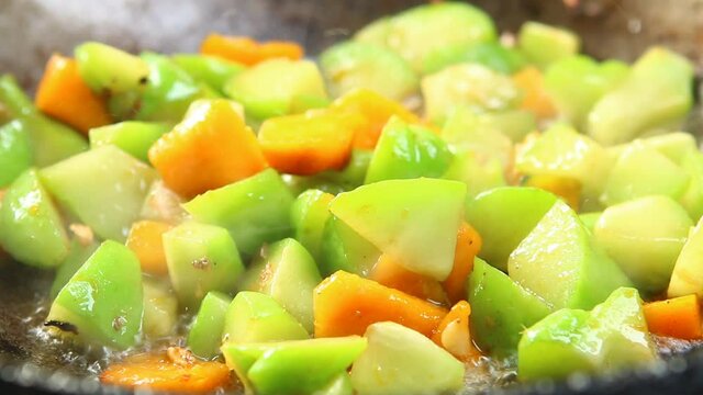 Frying chayote and pumpkin in pan, in door  Chiangmai  Thailand