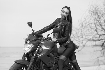 young woman with a sports motorcycle