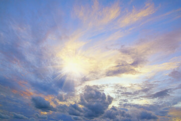 Clouds in sunset sky and light from sun.  Cirrocumulus clouds - obrazy, fototapety, plakaty