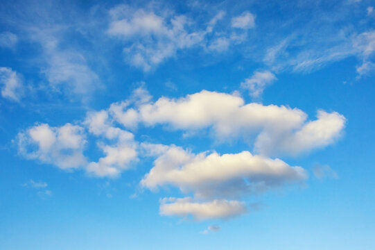 White clouds in blue sky.  Cumulus clouds