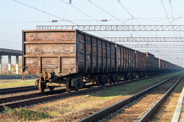 Fototapeta na wymiar Old rusty freight wagons at the marshalling yard