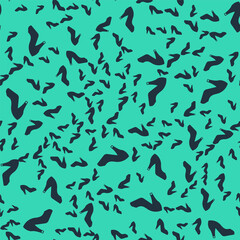 Black Woman shoe with high heel icon isolated seamless pattern on green background. Vector