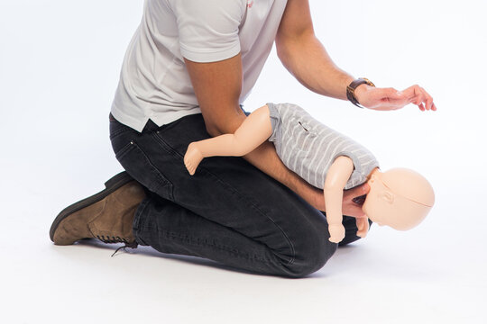 Demonstration of first aid on a baby dummy.