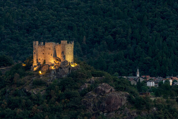 Fototapeta na wymiar The ancient castle of Ussel, Chatillon, Italy, illuminated by artificial lights in the evening