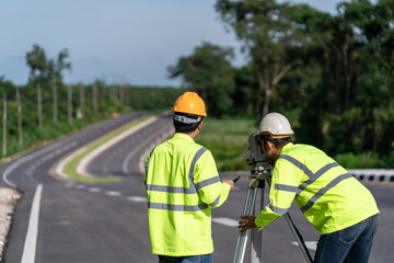 Teamwork of surveyor engineers with equipment on road construction site, Civil Engineers, Surveyor...