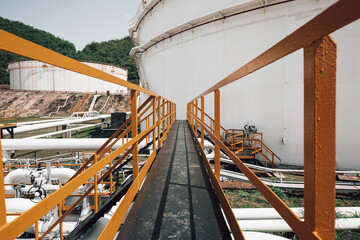 Steel long pipes and flange in crude tank oil factory during refinery Petrochemistry industry.
