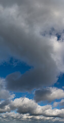 Fantastic clouds against blue sky, panorama