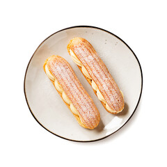 Traditional french eclairs filled with vanilla cream and powdered sugar. isolated on white background, top view